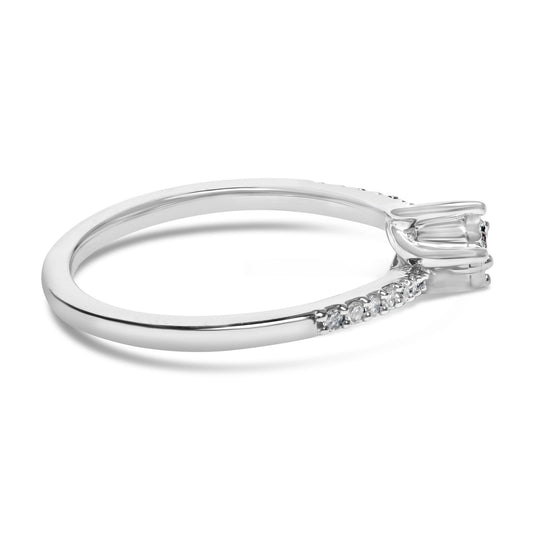Close-up side angle of a white ring featuring two round white gemstones in miracle setting and additional round white gemstones in shared prong setting along the band, shown on a white background.