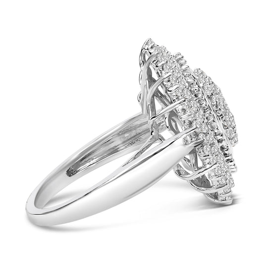 Close-up side angle of a white metal ring featuring a cluster of round white gemstones in prong settings and a row of baguette-shaped white gemstones in a channel setting.