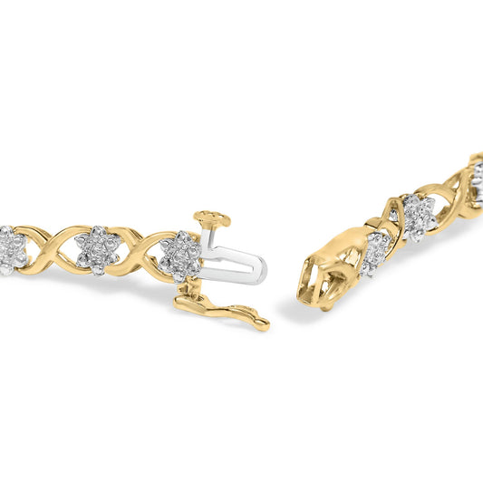 Close-up angled view of a bracelet with yellow and white metal featuring round white gemstones in prong settings arranged in flower shapes along an intertwined band, shown with the clasp open.