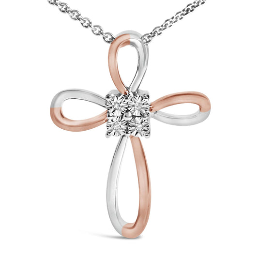 Close-up front angle of a white and rose metal cross-shaped necklace pendant featuring four round white gemstones in bezel settings at the center.