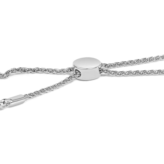 Close-up angled view of a white metal bracelet featuring a smooth oval slider and braided chain detail.