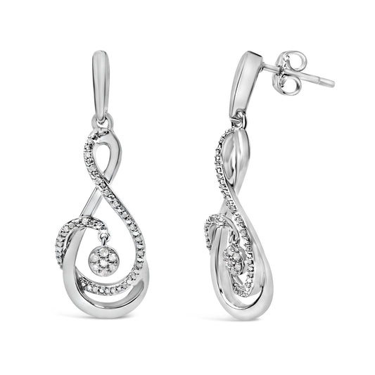 Pair of white metal drop earrings shown from front and side angles, featuring an elegant swirling design accented with small round white gemstones along the curves and a cluster of white gemstones in a circular setting hanging inside the swirl.