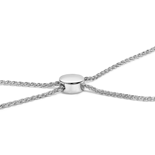 Close-up front angle of a white metal bracelet with a woven chain design and a smooth, round slider bead.
