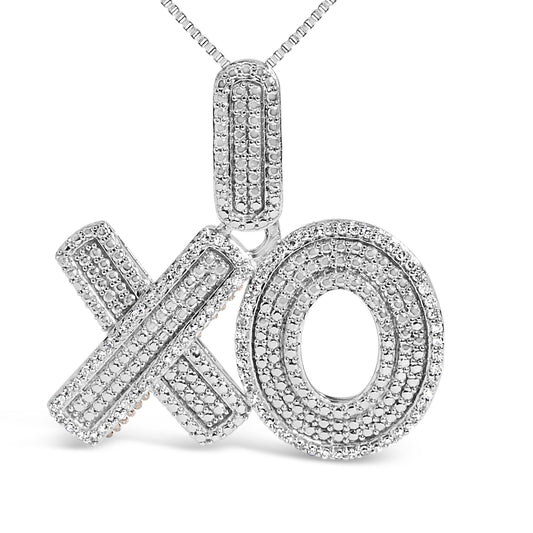 Close-up front view of a white necklace pendant featuring an 'X' and 'O' design adorned with multiple prong-set round white gemstones.