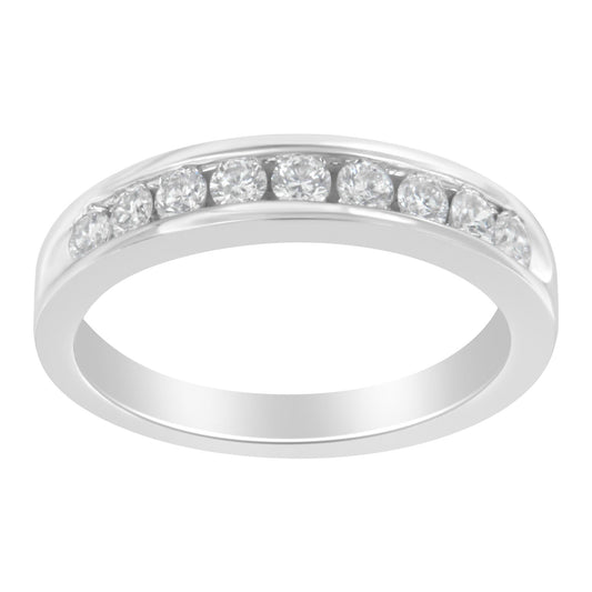 White metal ring with round white gemstones set in a channel, shown at a slight angle.