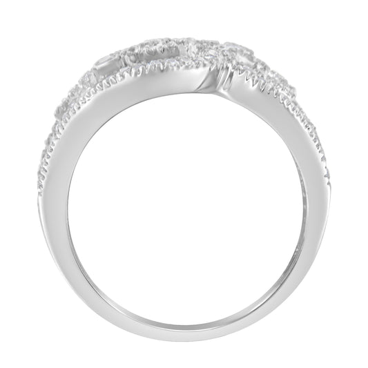 Side view of a white metal ring with round white gemstones, two in bezel settings and multiple in prong settings along the top.