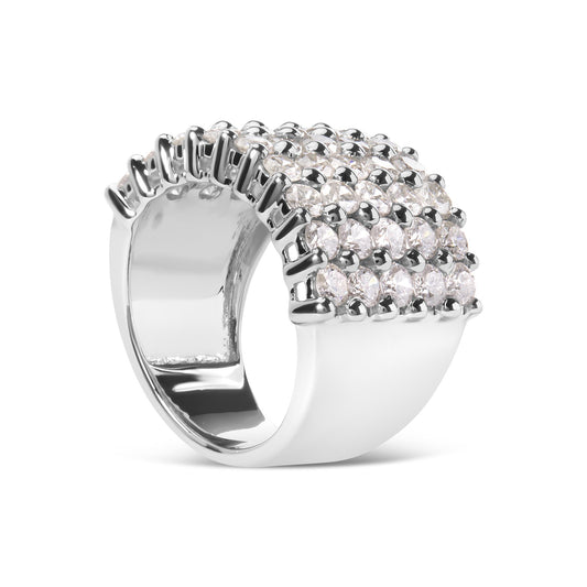 White metal ring with multiple rows of round white gemstones in prong settings, shown from a front angled view.