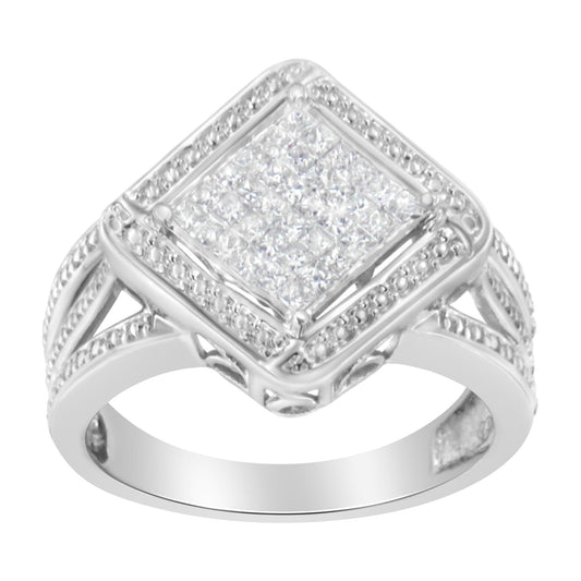 Front-facing close-up of a white metal ring featuring a large square top with multiple small white gemstones arranged in an invisible setting, surrounded by a halo of smaller white gemstones and decorative band detailing.
