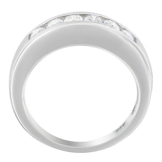 White metal ring with a channel setting of round white gemstones, viewed from above.