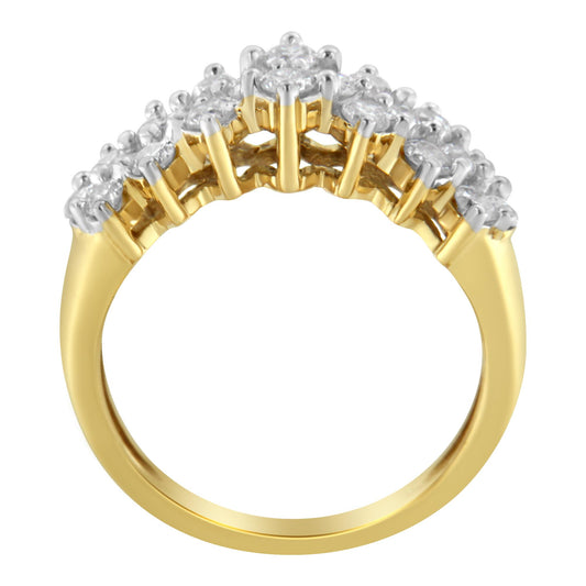Yellow metal ring with multiple round white gemstones in prong setting, shown from a side angle.