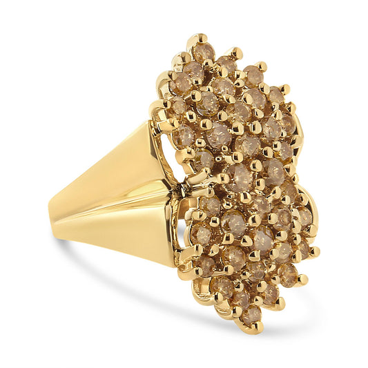 Yellow metal ring with clusters of round champagne-colored gemstones in prong settings, shown at a slight angle.