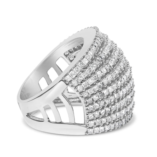 Close-up angled view of a wide white metal ring featuring multiple rows of princess-shaped white gemstones in a shared prong setting.