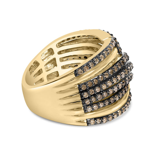 Close-up angled view of a yellow metal ring featuring multiple rows of champagne-colored round gemstones in prong settings across the top.