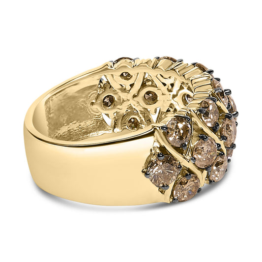Close-up side angle of a wide yellow metal ring featuring two rows of round champagne-colored gemstones set in prongs, with an intricate openwork design beneath the stones.
