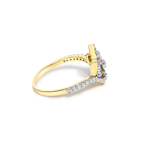 Yellow ring with white round gemstones in prong setting, shown in a side angle.