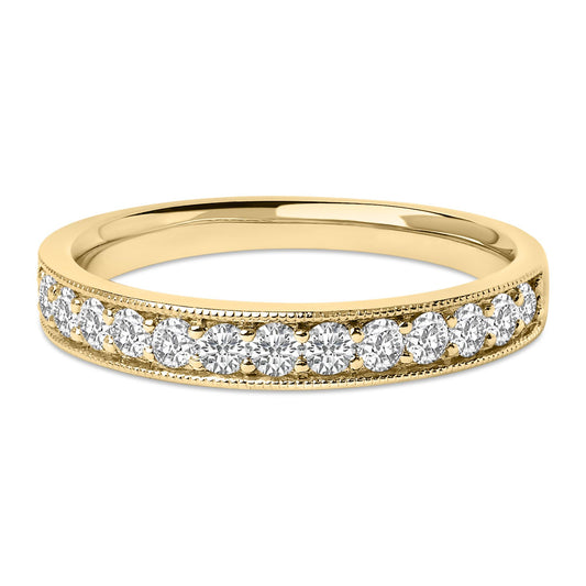 Close-up front angle of a yellow metal ring with a row of round white gemstones in a micro-pave setting along the band.