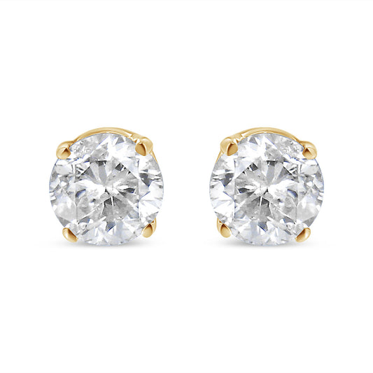 Front view of round white gemstone stud earrings set in yellow metal with four-prong settings, shown against a white background.