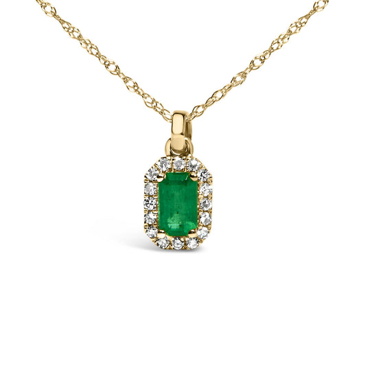 Front view of a yellow metal necklace with a pendant featuring a green rectangular gemstone surrounded by small white round gemstones in micro-pave setting.