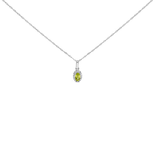 Front-facing shot of a white necklace with a small oval yellow gemstone pendant surrounded by round white gemstones.
