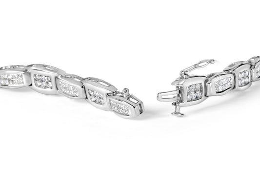 Close-up image of a white metal bracelet with sections featuring round white gemstones in prong settings and princess-shaped white gemstones in invisible settings, shown from a slightly angled top view with the clasp open.