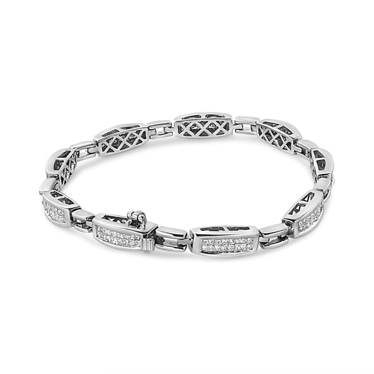 White metal bracelet with sections of white princess-shaped gemstones in invisible setting, shown in a flat lay top-down angle.