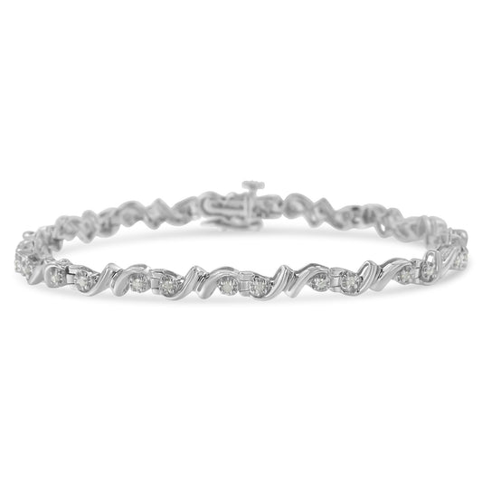 White metal bracelet with alternating round white gemstones set in a wavy pattern, shown in a close-up front angle.