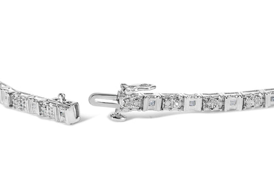 Close-up side angle of an open white bracelet featuring alternating round white gemstones in pave setting and baguette white gemstones in channel setting.