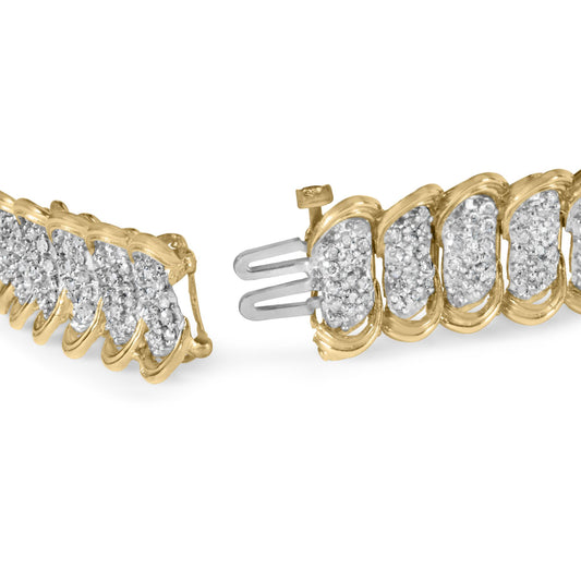 Close-up front angle of an open yellow metal bracelet featuring multiple sections with clusters of small white gemstones in prong settings.