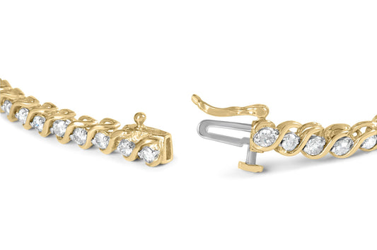 Close-up front angle of a yellow metal bracelet with round white gemstones in prong settings and a visible clasp.