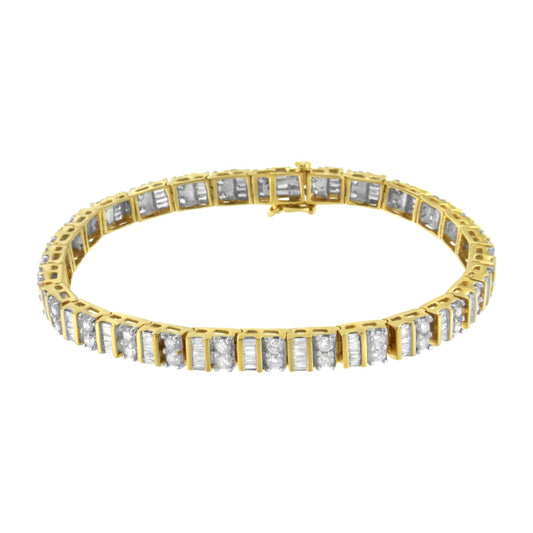Yellow bracelet with alternating rows of white round gemstones in prong settings and white baguette gemstones in channel settings, shown in a front angle view.