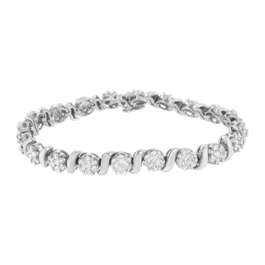 White metal bracelet with round white gemstones in prong settings, shown from slightly above angle.