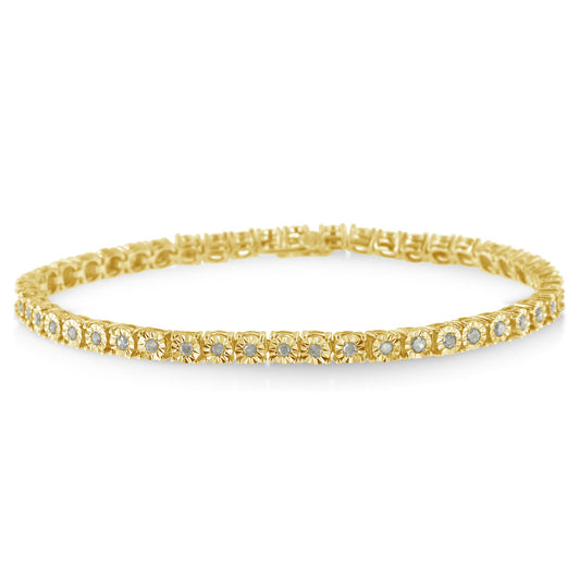 Close-up of yellow bracelet with round white gemstones in a continuous setting, shot from a slightly angled side view.