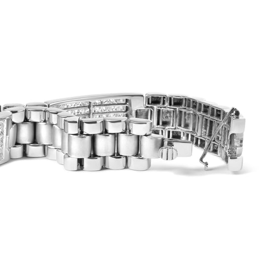 Close-up side view of a white metal bracelet with linked segments and two rows of white princess-shaped gemstones in an invisible setting, showing the clasp open.