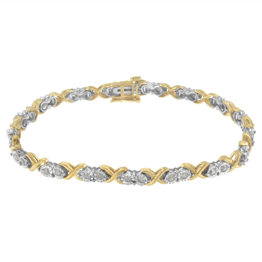 Two-toned bracelet with alternating crisscross links and round white gemstones in miracle settings, shown in a top-down angle.