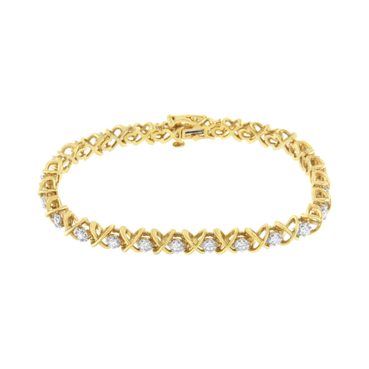 Yellow metal bracelet with alternating X-shaped links and white round gemstones, shown from a slightly angled top view.