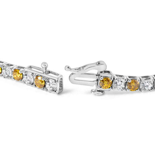 Close-up image of a white metal bracelet clasp with alternating yellow and white round gemstones in a 4-prong setting shown from a front side angle.
