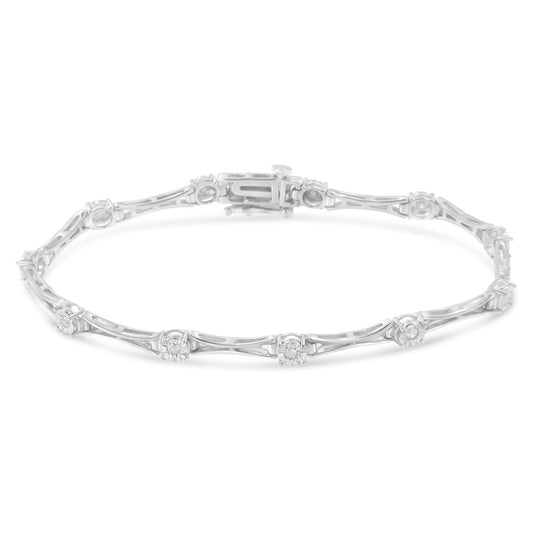 White metal bracelet with round white gemstones in a miracle setting, shown from a slightly elevated front angle.