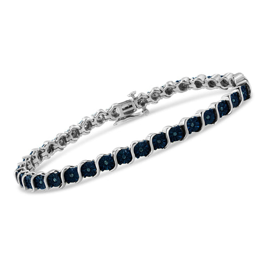 White metal bracelet with round blue gemstones in a Miracle setting, shown at an angled top-down view.