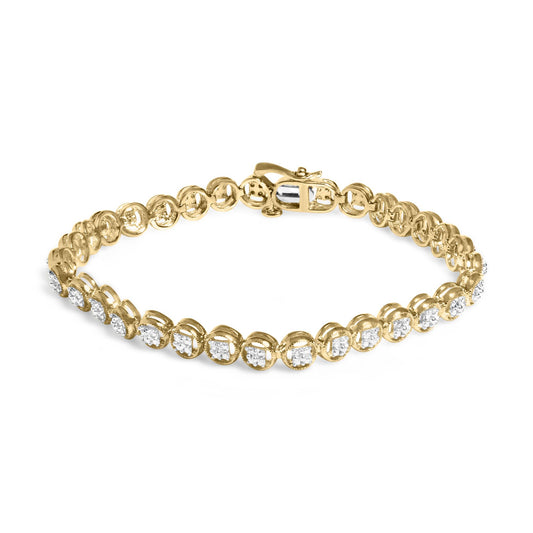 Yellow metal bracelet with prong-set round white gemstones, shown at a slight overhead angle.