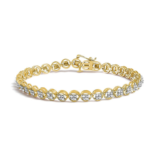 Yellow metal bracelet with round white gemstones in prong settings, shown from a slightly elevated side angle.