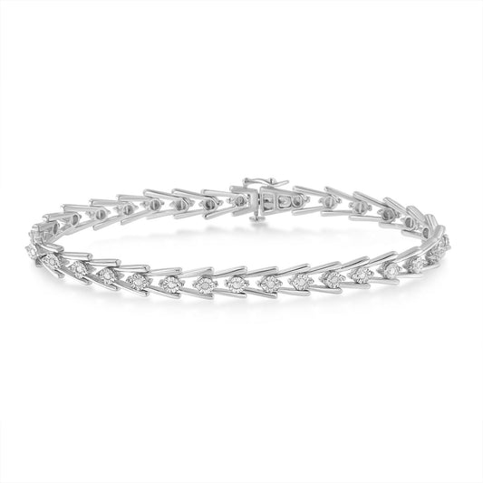 White metal bracelet with round white gemstones in miracle setting, shown from an angled top view.