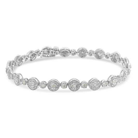 White metal bracelet with round white gemstones in a miracle setting, shown from a front angled view.