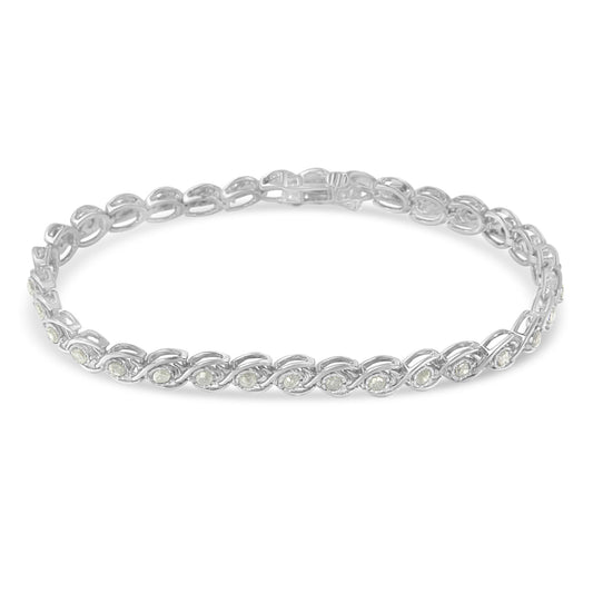 Bracelet with white metal chain and round white gemstones in a miracle setting, shown from a top angle.