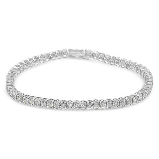 White metal bracelet with round white gemstones in miracle setting, shown from a slightly elevated front angle.