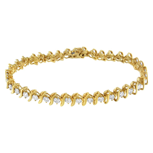 Yellow metal bracelet with round prong-set white gemstones, shown from a side angle.