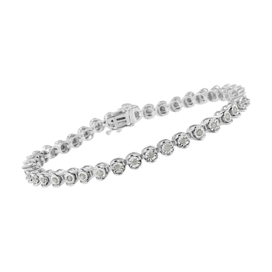 White metal bracelet with round white gemstones in a miracle setting viewed from an angled side shot.
