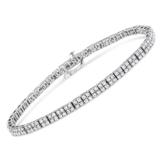 White metal bracelet with multiple rows of round white gemstones in prong settings, shown at an angled top view.