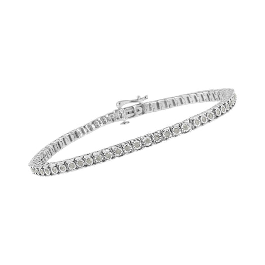 White metal bracelet with round white gemstones in channel setting, shot at a slight angle.
