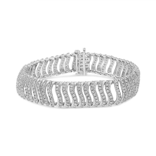 White metal bracelet with wavy openwork design, set with round white gemstones in prong settings, shown from an angled front view.