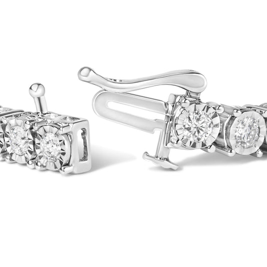 Close-up angled view of a white metal bracelet clasp featuring round white gemstones set in miracle settings.